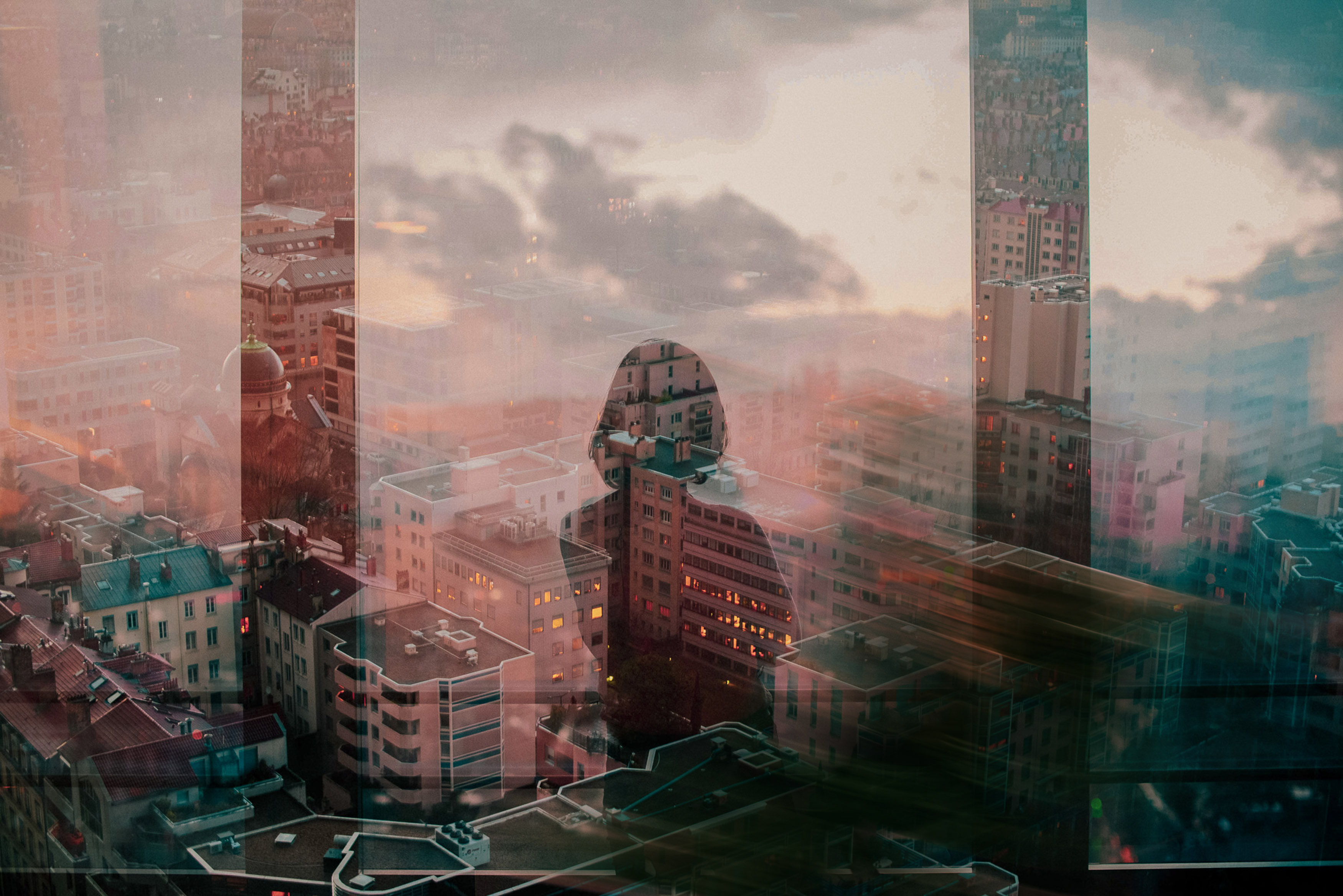 Female Silhouette Overlooking Cityscape